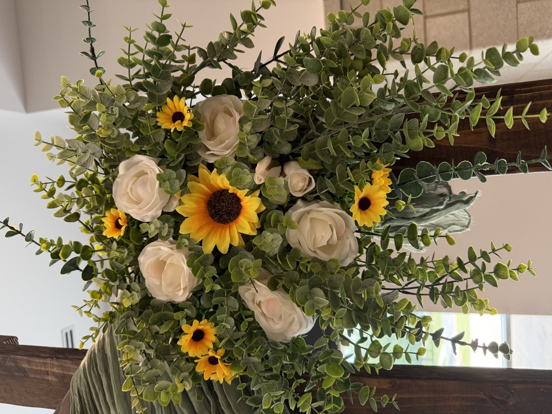 Rose, sunflower and eucalyptus arrangement