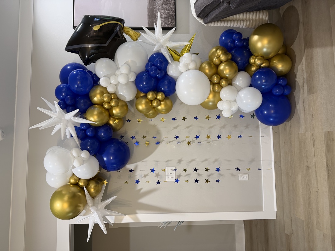 Navy and gold graduation balloon arch